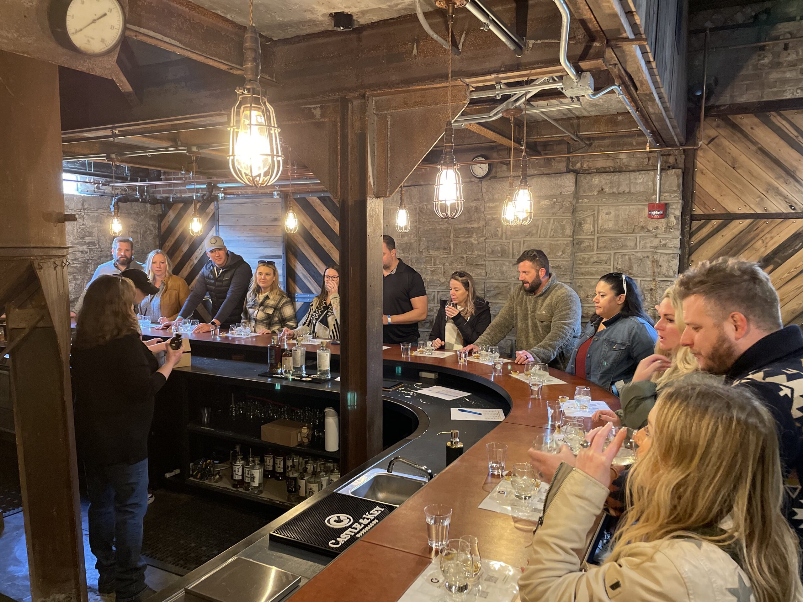 corporate group doing bourbon tasting at castle & key